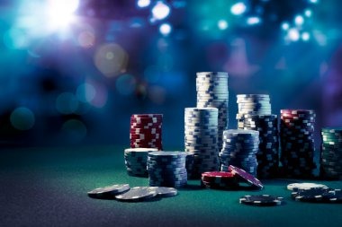 Live dealer handling cards at Bikini Paradise baccarat table with betting layout visible